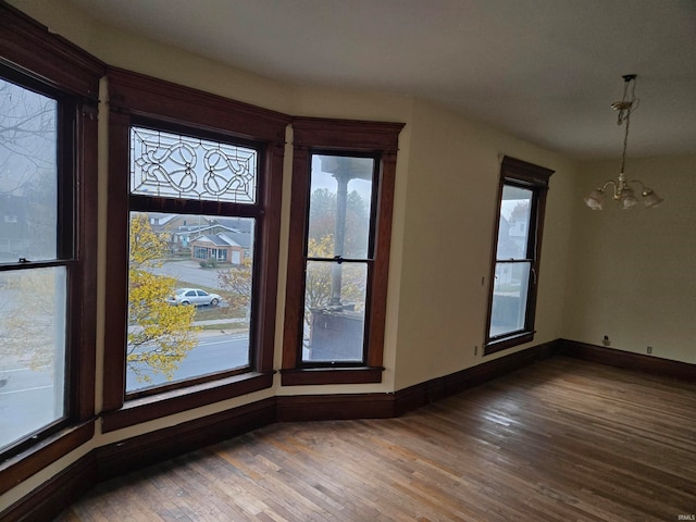 interior space featuring a notable chandelier and hardwood / wood-style flooring