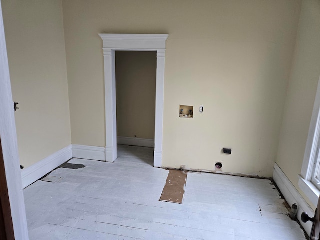 clothes washing area featuring light wood-type flooring and hookup for a washing machine