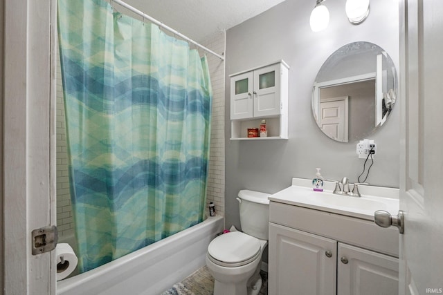 full bathroom with shower / bathtub combination with curtain, hardwood / wood-style floors, a textured ceiling, toilet, and vanity