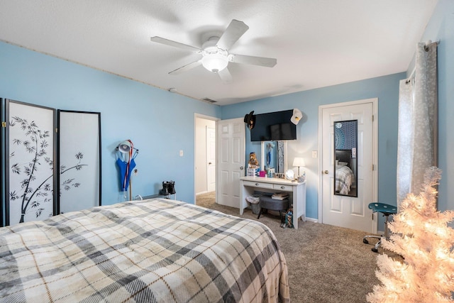 bedroom featuring carpet, a textured ceiling, and ceiling fan