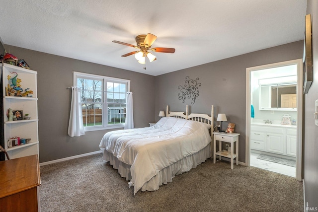 bedroom featuring connected bathroom, ceiling fan, carpet floors, and a textured ceiling