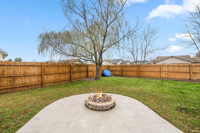 view of yard featuring a fire pit and a patio area