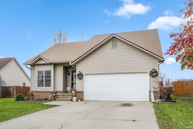 view of front facade featuring a front yard and a garage