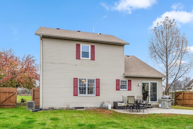 back of house with cooling unit, a yard, and a patio