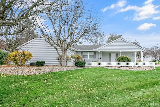 ranch-style house featuring cooling unit and a front yard