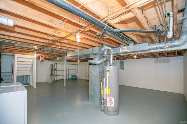 basement featuring gas water heater and washer and clothes dryer