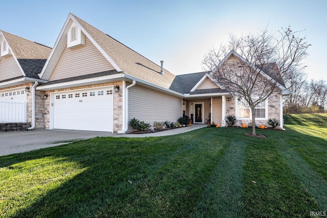 view of front of home featuring a front yard and a garage