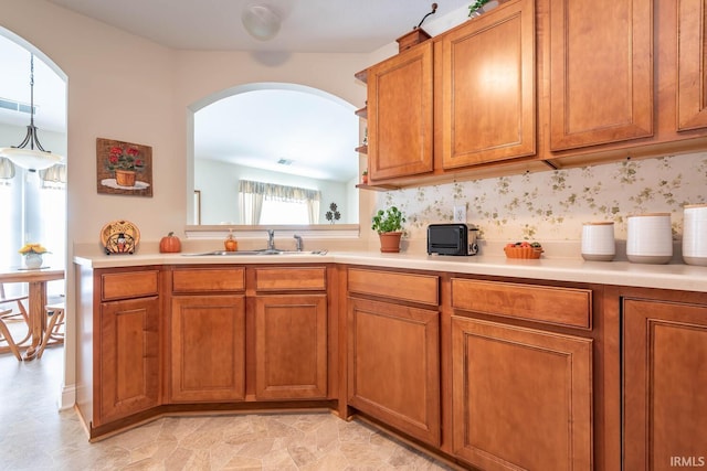 kitchen featuring sink and decorative light fixtures