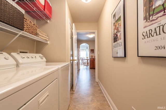 clothes washing area featuring separate washer and dryer