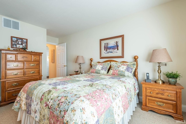 bedroom featuring light colored carpet