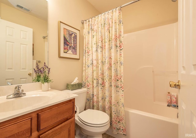 full bathroom with vanity, shower / bathtub combination with curtain, and toilet