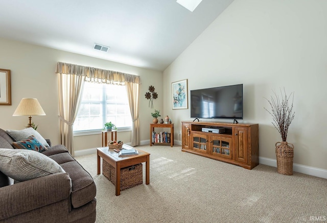 carpeted living room featuring vaulted ceiling