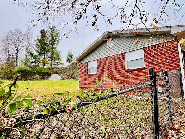 view of property exterior with a yard