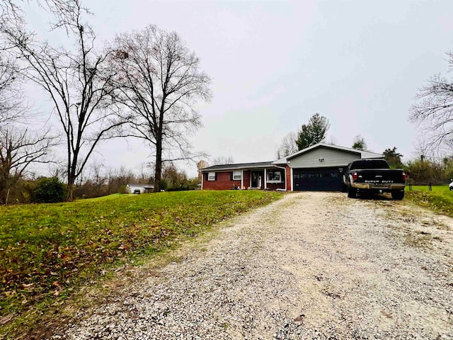 view of front facade with a front lawn and a garage