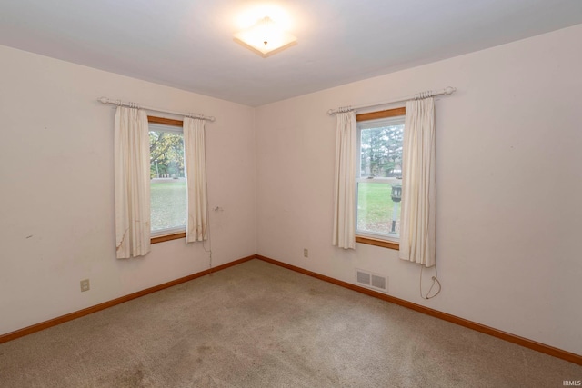 unfurnished room featuring carpet floors