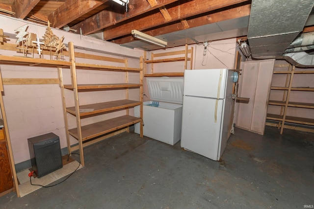 basement featuring white fridge