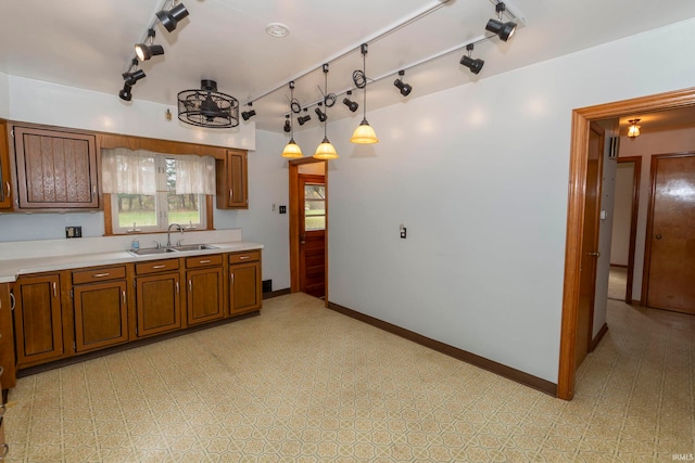 kitchen featuring sink and pendant lighting