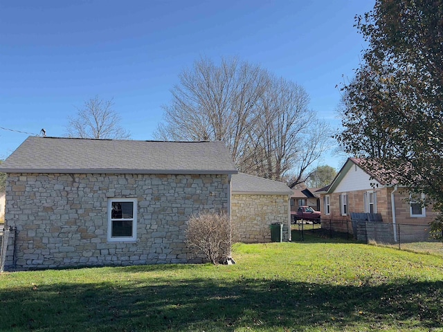 view of property exterior featuring a lawn