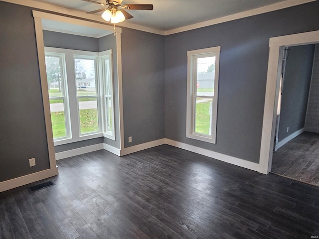 unfurnished room featuring ceiling fan, dark hardwood / wood-style floors, and ornamental molding