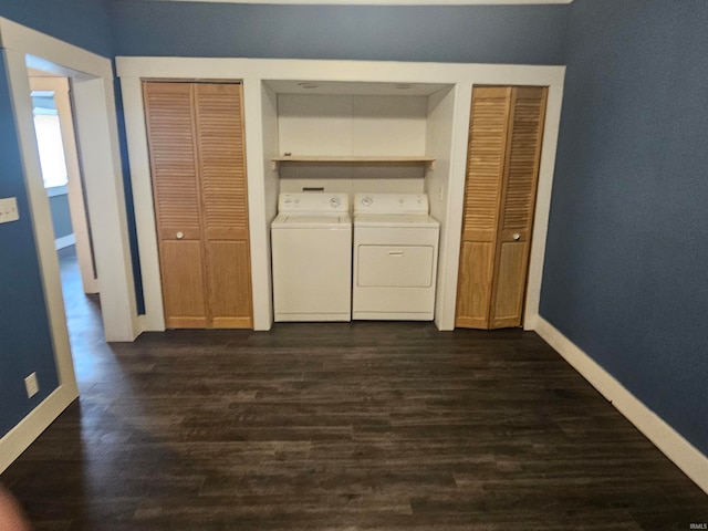 laundry room featuring dark hardwood / wood-style flooring and washing machine and clothes dryer