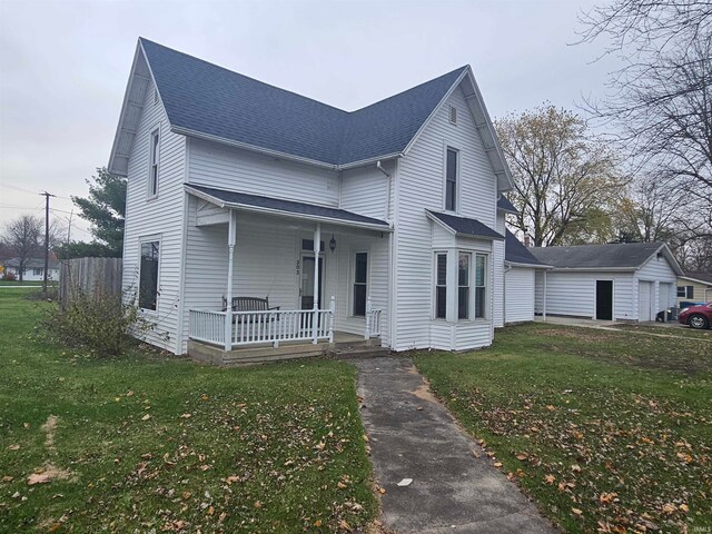 view of front facade with covered porch and a front yard