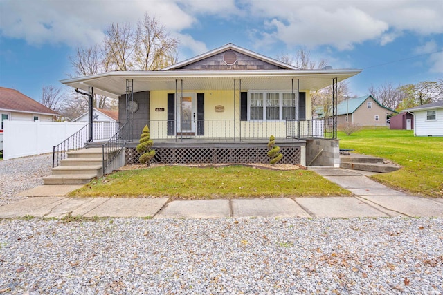 bungalow-style house with a porch and a front yard