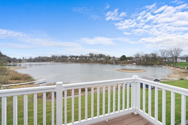 exterior space with a lawn and a water view