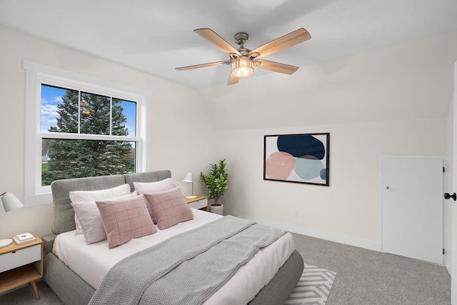 carpeted bedroom featuring ceiling fan and lofted ceiling