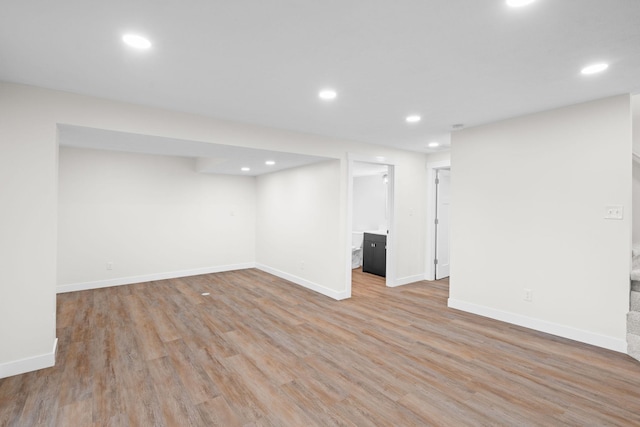 basement featuring light wood-type flooring