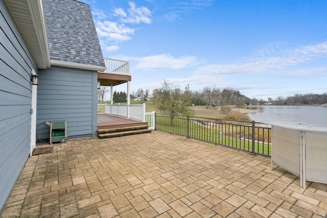 view of patio / terrace featuring a deck with water view