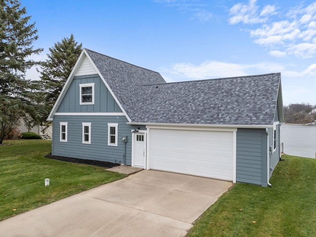 view of front of property with a front yard and a garage