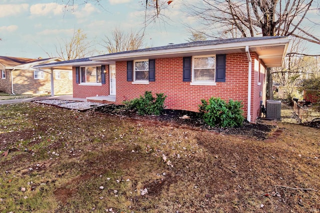 ranch-style home featuring central air condition unit