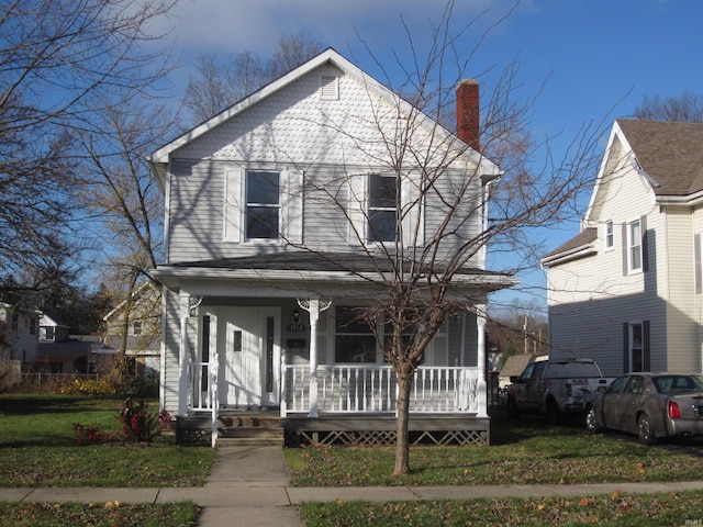 1314 S Boots St, Marion, IN 46953 - view of front of property with a porch, a chimney, and a front yard