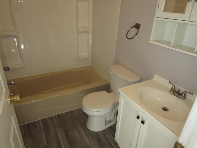 full bathroom with hardwood / wood-style floors, vanity, toilet, and bathtub / shower combination