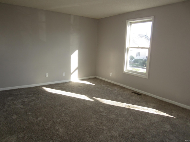 unfurnished room with carpet floors