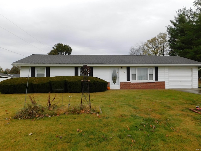 ranch-style house featuring a garage, a front yard, brick siding, and driveway