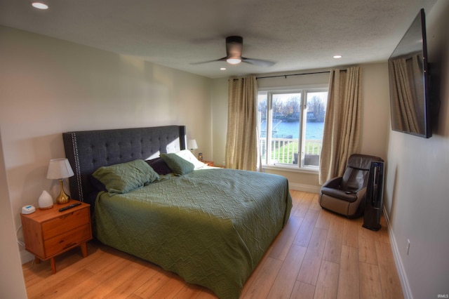 bedroom with ceiling fan and wood-type flooring