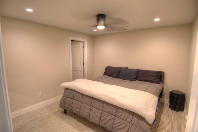 bedroom with ceiling fan and light colored carpet