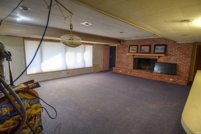 unfurnished living room featuring carpet flooring, brick wall, and a brick fireplace