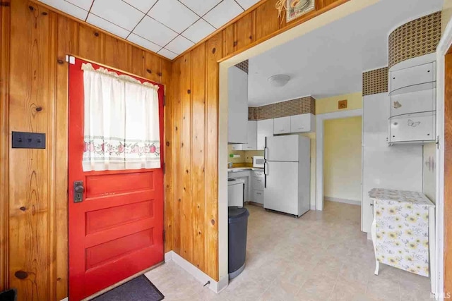 interior space featuring wooden walls