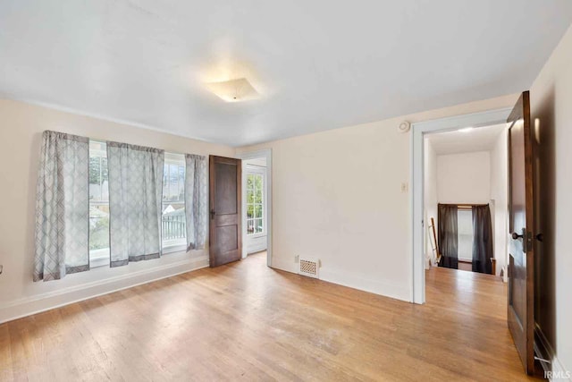 unfurnished room featuring light hardwood / wood-style flooring