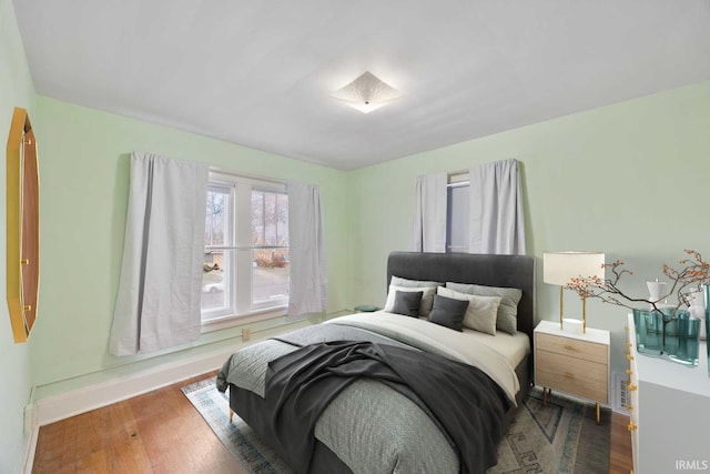 bedroom with wood-type flooring