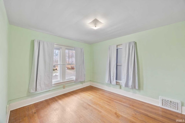 empty room featuring hardwood / wood-style flooring