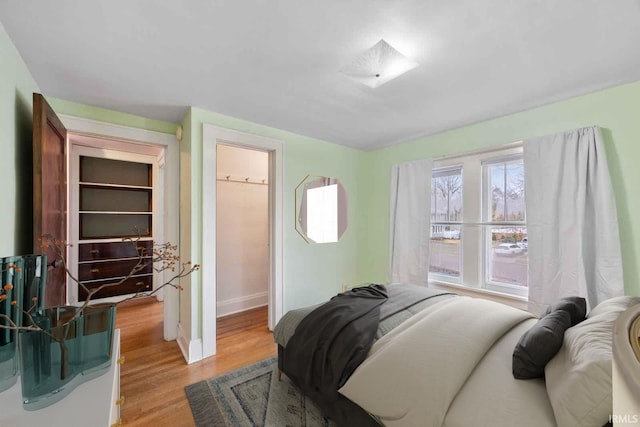 bedroom with light wood-type flooring