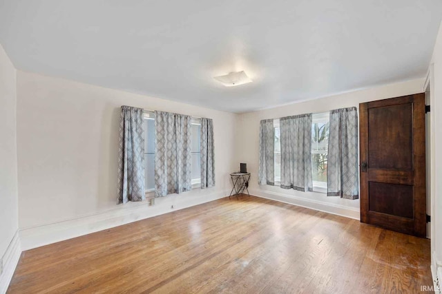 spare room with light hardwood / wood-style floors