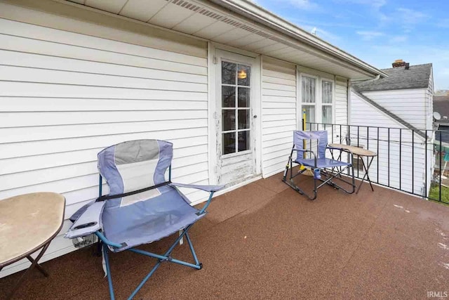 view of patio featuring a balcony