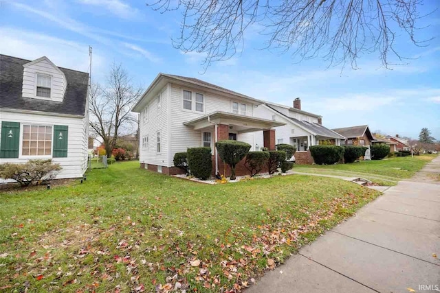 view of front of property with a front lawn