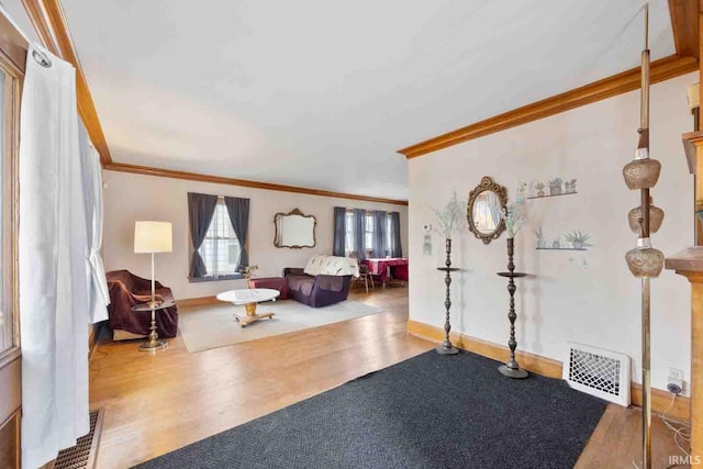 entrance foyer with wood-type flooring and ornamental molding