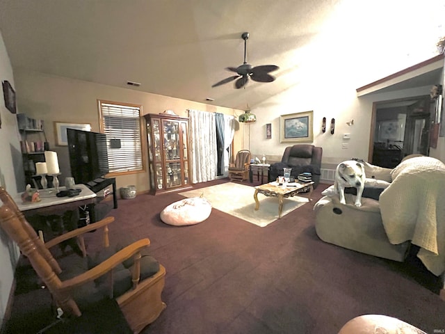 living room with ceiling fan, lofted ceiling, and carpet floors