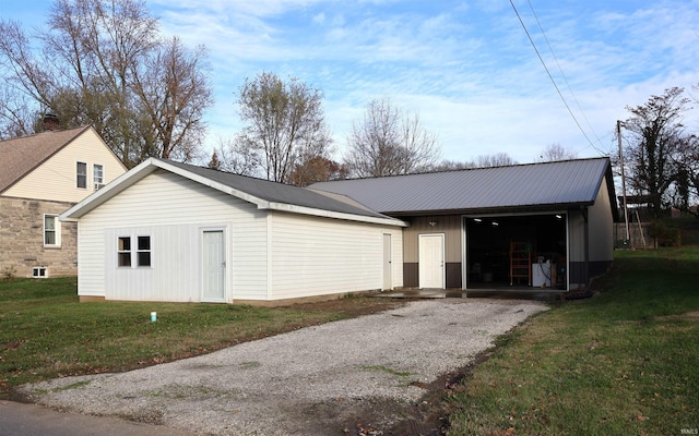 exterior space featuring a yard and an outdoor structure